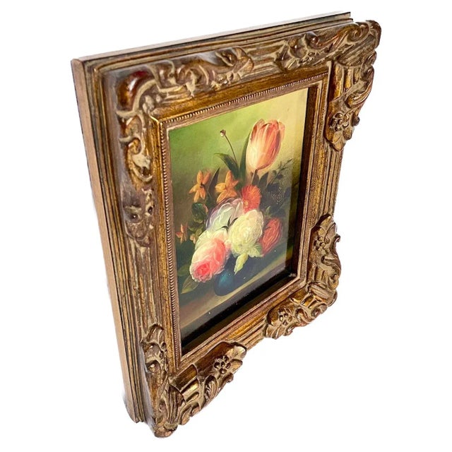 Vintage floral arrangement oil painting with carved ornate gilt-wood frame. Signed "Hanna" on lower right corner.