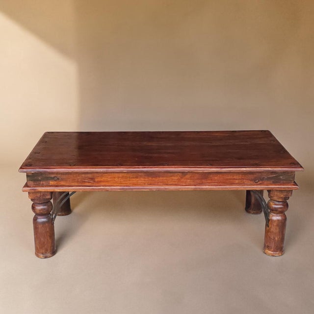 Substantial vintage coffee table in the Spanish Colonial Revival manner, featuring a richly toned hardwood top with...