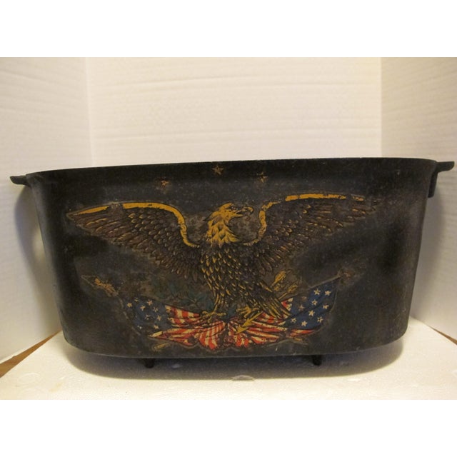 Incredibly cool folk art! Cast Iron boiler with an eagle holding 2 American flags in each talon. Very unique piece with...