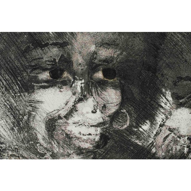 Drawing on paper representing faces done in black ink, XXth Century. Drawing on paper representing faces done in black...