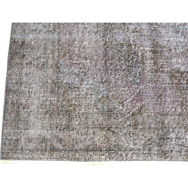 Hand-knotted with care using traditional rug making techniques, this wool rug blends timeless craftsmanship with a modern...
