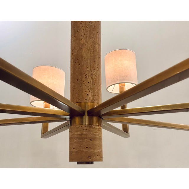 Original retail $2958, stylish Currey & Company Modern Travertine Commune Chandelier, antique brass finished frame, seven...