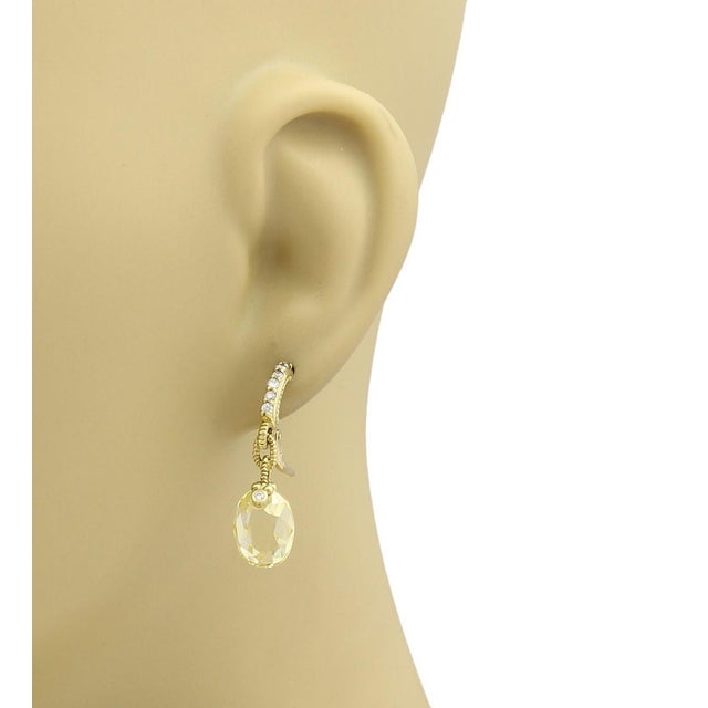 The Judith Ripka Diamond Canary Crystal 18k Yellow Gold Dangle Earrings are exquisite pieces of vintage and antique...