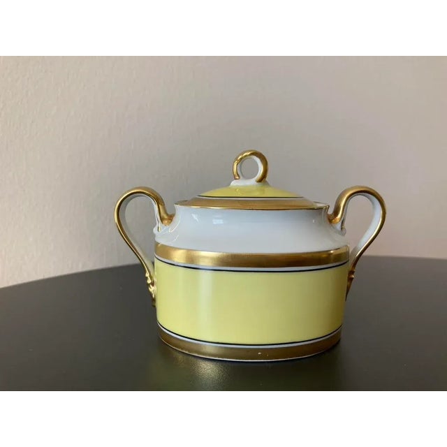 A vintage Italian Richard Ginori 'Contessa' yellow and gold porcelain sugar bowl with lid, circa mid to late-20th century,...