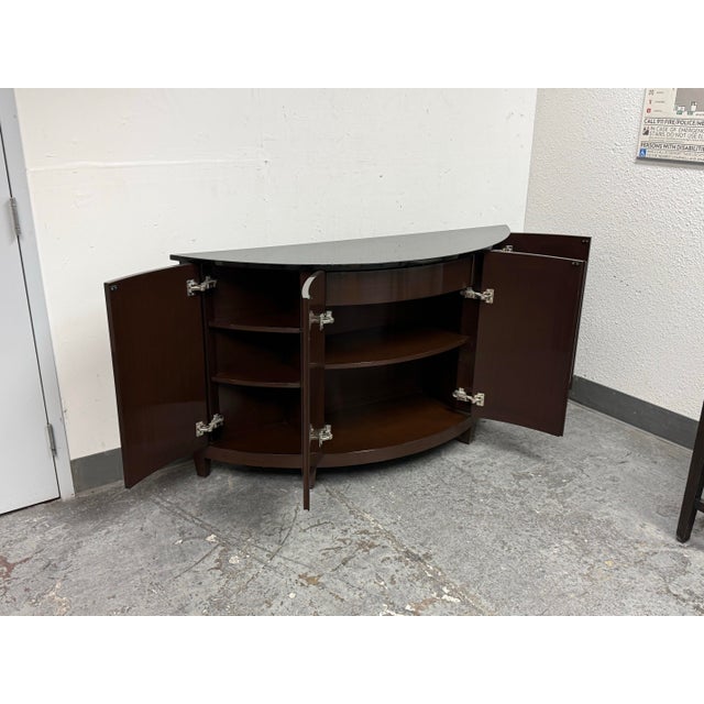 Design Plus Gallery presents the Harlequin Demilune Buffet/Sideboard from Nancy Corzine. This demilune form has paneled...