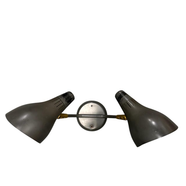 Vintage two-light wall sconce by Gerald Thurston. Adjustable shades with turn knob on and off switches. 19" Wide 8" Deep...