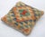 A one-of-a-kind handwoven Afghan wool kilim accent pillow featuring diamond lattice. Cut and sewn by hand from a flat-...
