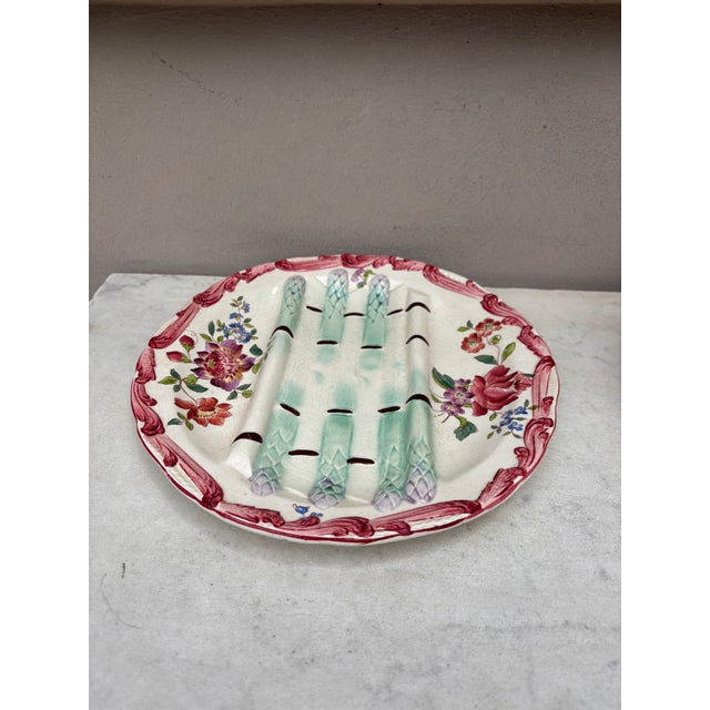 Majolica asparagus plate with flowers , signed Longchamp circa 1890.