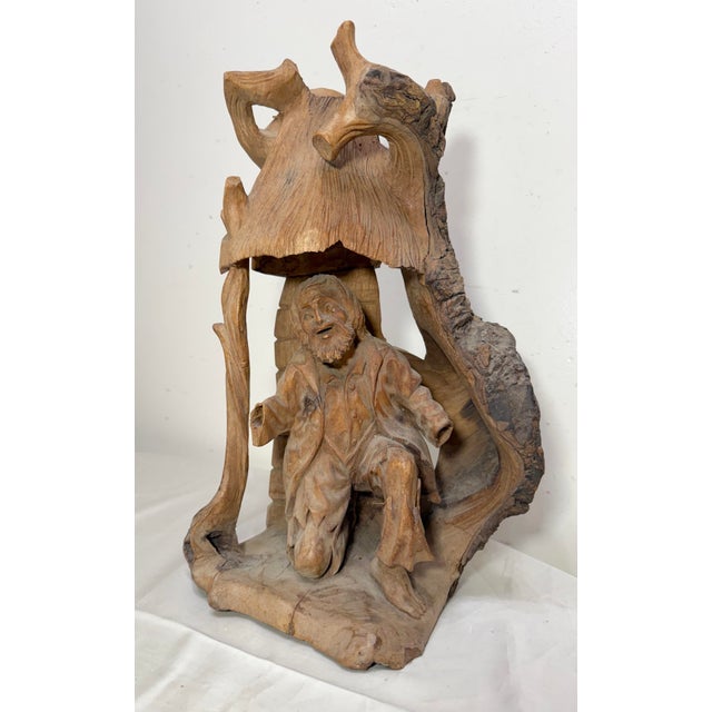 This antique hand carved German figural tree trunk sculpture is a unique and charming piece of decorative collectible....
