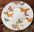 Whimsical MacKenzie-Childs enamel metal serving plate featuring a vibrant array of signature patterned butterflies set...