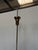 Elegant chandelier in polished brass and black, with white opal glass diffusers, designed by Bruno Gatta and produced by...