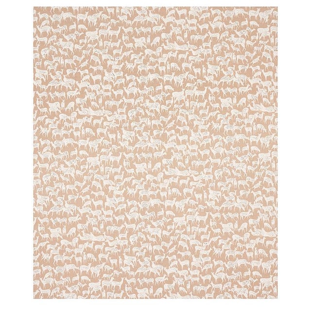 Miniature herds of hand-drawn deer, each with a distinct expression, give this small-scale and slate blue fabric design...