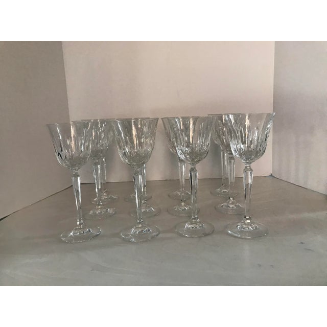 Set of twelve Mikasa “Interlude” wine glasses. Manufactured from 1983 -1994. Vertical cuts, six sided stem. Measures 8”...