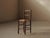 Simple and sturdy folk chair dating from around 1900, with a solid wood frame and a traditionally woven rush seat,...
