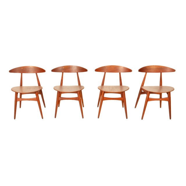 A very good set of four Danish Mid Century Modern original early Hans Wegner designed CH 33 teak chairs for Carl Hansen &...