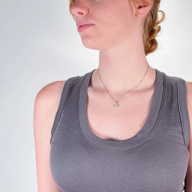 A fine vintage Lady's diamond pendant necklace. With a round brilliant cut ca. 0.57 ct. diamond center set in a 14k white...