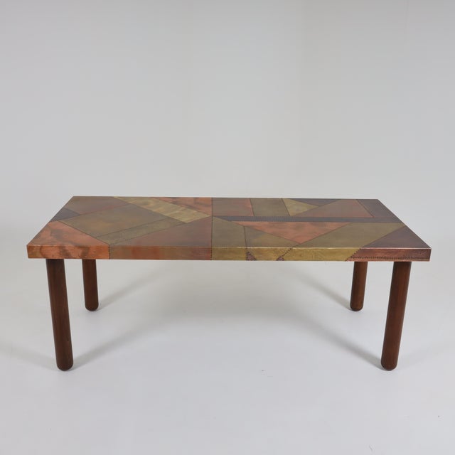 Italian Modernist dining table by Lorenzo Burchiellaro Wooden legs and shelves made of hammered and riveted metal surfaces...