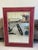 Large faux alligator framed rectangular mirror the color is a raspberry red having a cream edging and silver colored...
