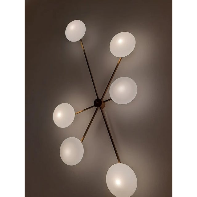 Wall Lamp Model Six Runes Polished Brass in the style of Angel Lelii for Arredoluce, in Flawless conditions. Designed 1980...