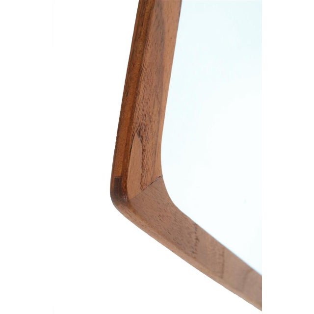 1960s wall mirror from Denmark. Restored frame made of solid teak. High-quality workmanship. Pleasant, smooth, satin-matte...