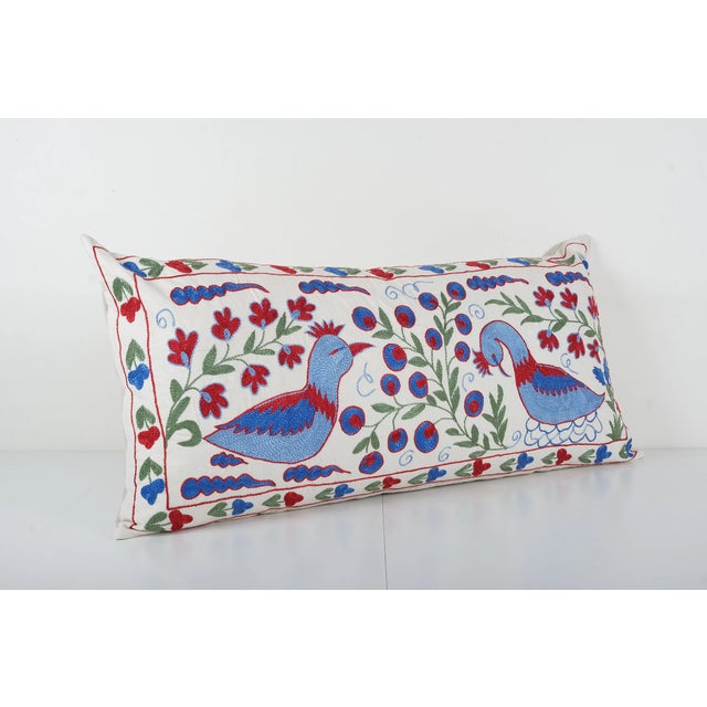 Tashkent Suzani Lumbar Cushion Elevate your home decor with our Turkish Suzani Pillow Cover, featuring exquisite vintage...