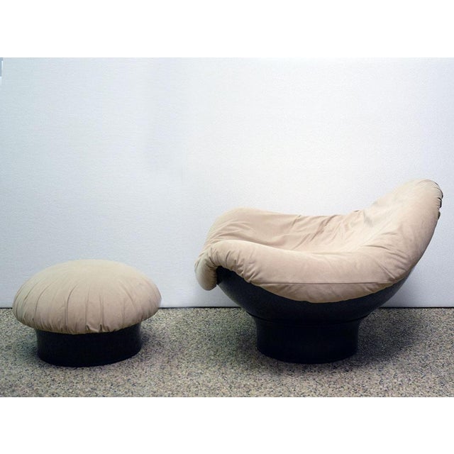 Armchair with pouf model Rodica designed by Mario Brunu for Comfort 1970s. Black painted fibreglass shell, armchair and...