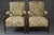 A refined pair of British lounge chairs, dating from the late Victorian to early Edwardian period (circa 1890–1910). These...