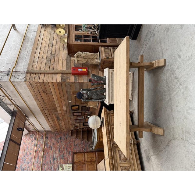 This antique solid oak table has been fully restored. It features a beautiful, thick tabletop and a sturdy base with a...