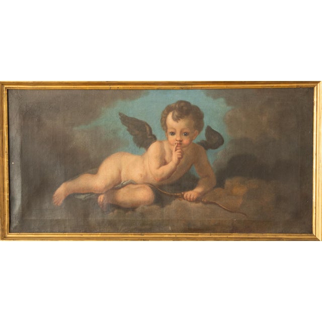 A pair of oil paintings on canvas depicting putti from the second half of the 18th century. Venetian School. Set in thin...