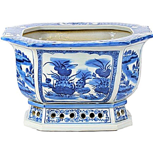 This is a contemporary Chinoiserie large blue and white jardiniere. This planter is designed with beautiful vignettes on...