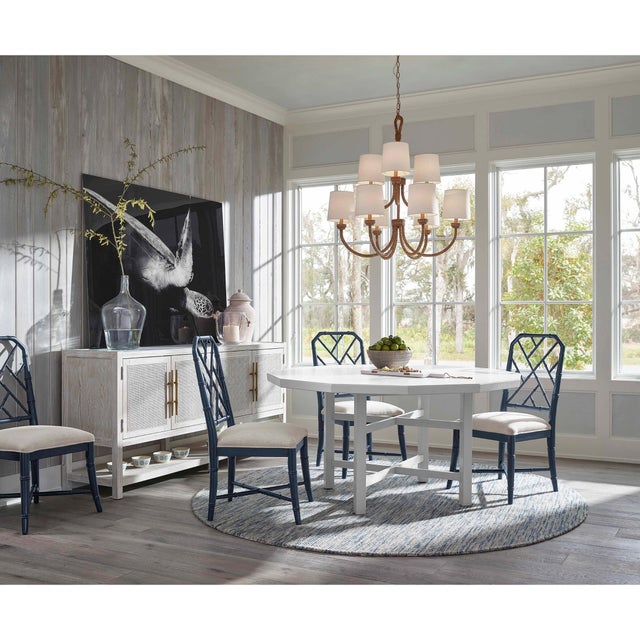 Natural woven rattan provides a "washed ashore" look on the Bimini chandelier. Looped detailing also provides a nautical...