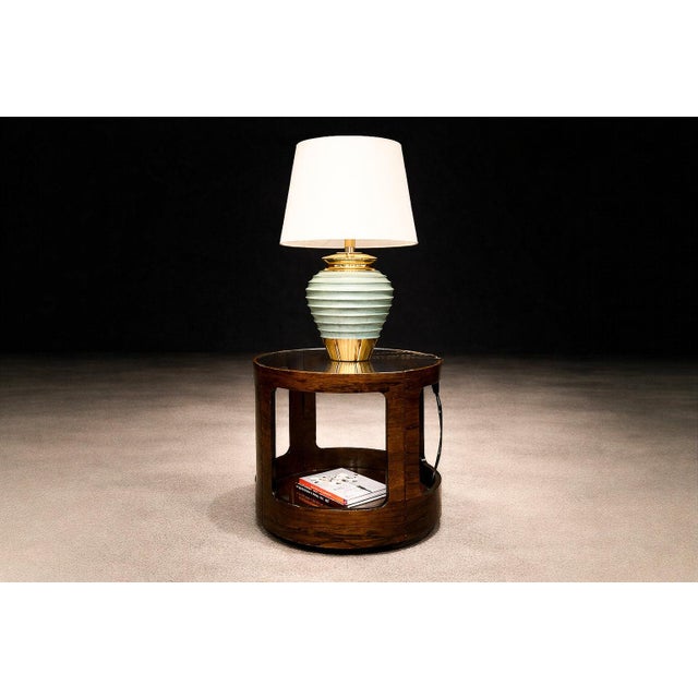 This sculptural Brazilian modern two-level side table, attributed to Bertomeu, was produced in Brazil during the late...