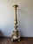 An Antique European oak candlestick, circa 1880, combines the strength of oak with a luxurious gilded finish, this piece...