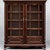 This is an American Victorian era carved mahogany barley twist bookcase or display cabinet. It dates roughly to 1900. The...