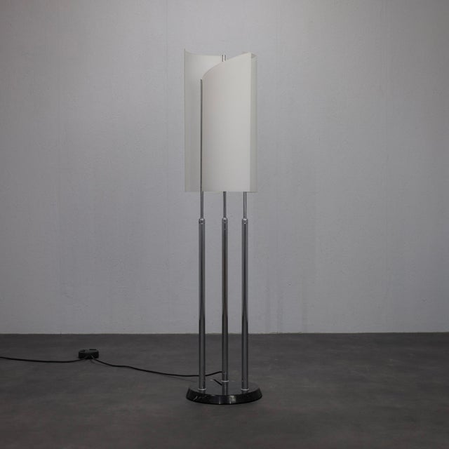 An elegant and highly collectible arianna floor lamp, designed by bruno gecchelin for the renowned italian lighting...