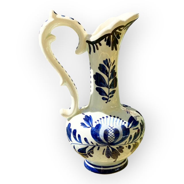 Bring a touch of Dutch elegance and tradition into your home with this refined vintage Delft jug , an authentic work of...