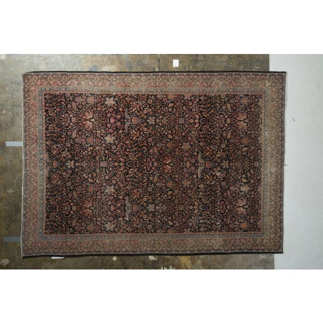 Handmade in wool originating from India circa 1890-1900, this antique 6x9 rug features an uncommon colorway pagination...
