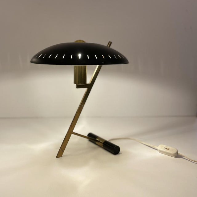Decora (also known as z) desk lamp in brass and black painted brass designed by louis christiaan kalff in 1956 for...