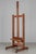 An early 20th century French painter's easel made of solid oak with ledge to hold the canvas. Adjustable, with simple...