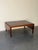 Danish Mid-Century Modern coffee table crafted in richly grained rosewood. This versatile drop-leaf design features two...