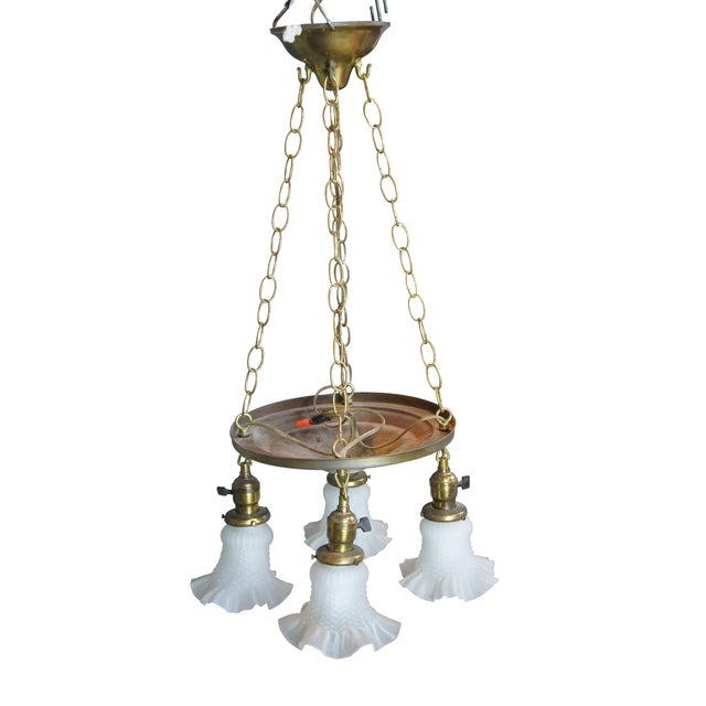 Antique drop light pendant chandelier. Made of brass featuring Victorian styling with four ruffled frosted / satin glass...