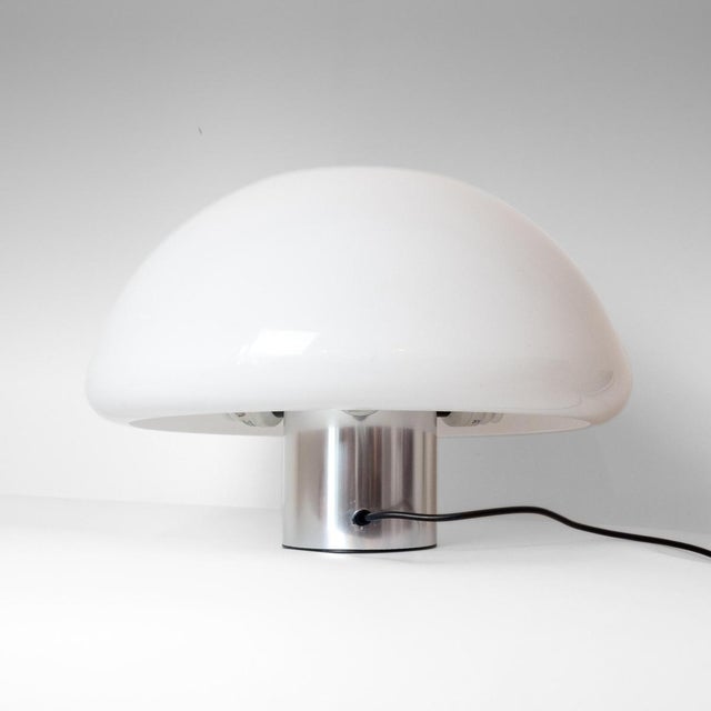 Guzzini Model 4030 Table Lamp, an authentic example of Italian Space Age design from the 1970s. This lamp stands out for...