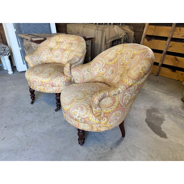 An exquisite, authentic pair of antique French fauteuils crapaud (traditionally known as "crapaud" or "toad" chairs due to...