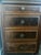 Large double pedestal executive desk in burl walnut veneer with antique brass reeded knobs and turned baluster legs. Eight...