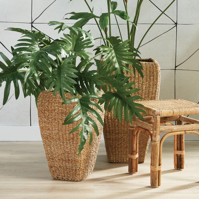 This set of tall seagrass planters are tightly woven around a wire metal frame. This warm, natural look in an overscaled...