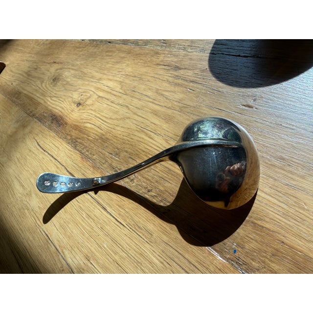 The spoon features a distinct stopper ‘spur’ on the back of the handle designed to prevent it from sliding into a dish....