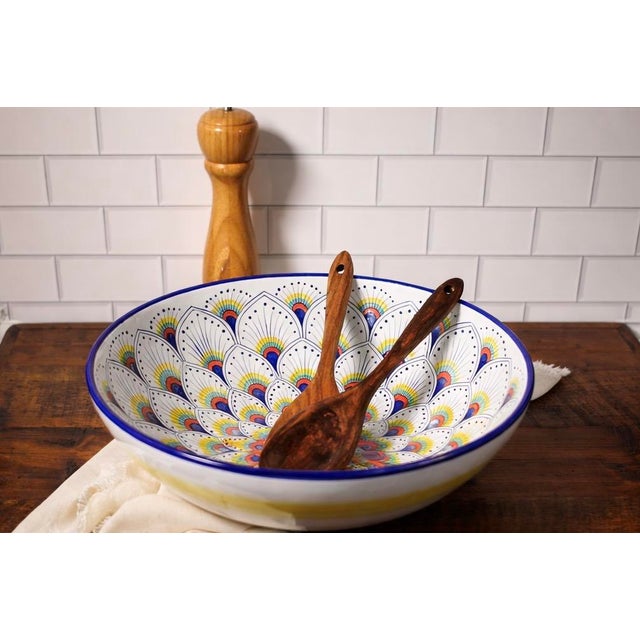 The Intreccio Large Serving Bowl brings centuries of Italian ceramic artistry to your table. Hand-painted by master...