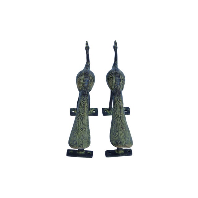 A pair of large green brass peacock door handles or cabinet pulls. Cast with intricate details throughout. Dimensions per...