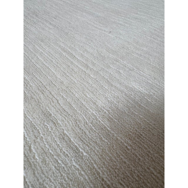 RH Luz Rug – 6' x 9' – Ivory – New Zealand Wool – Handwoven Elegance Elevate your space with the soft luminosity of the...