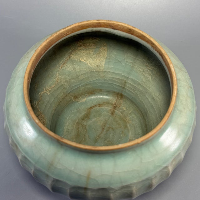 Fine antique Chinese celadon covered jar. Melon‑ribbed lobed body with matching lotus‑form lid, elegant silhouette,...